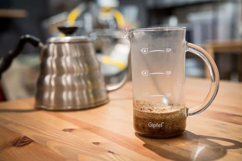 How to make French Press Coffee - Step 3: Add water - CoffeeHow.co