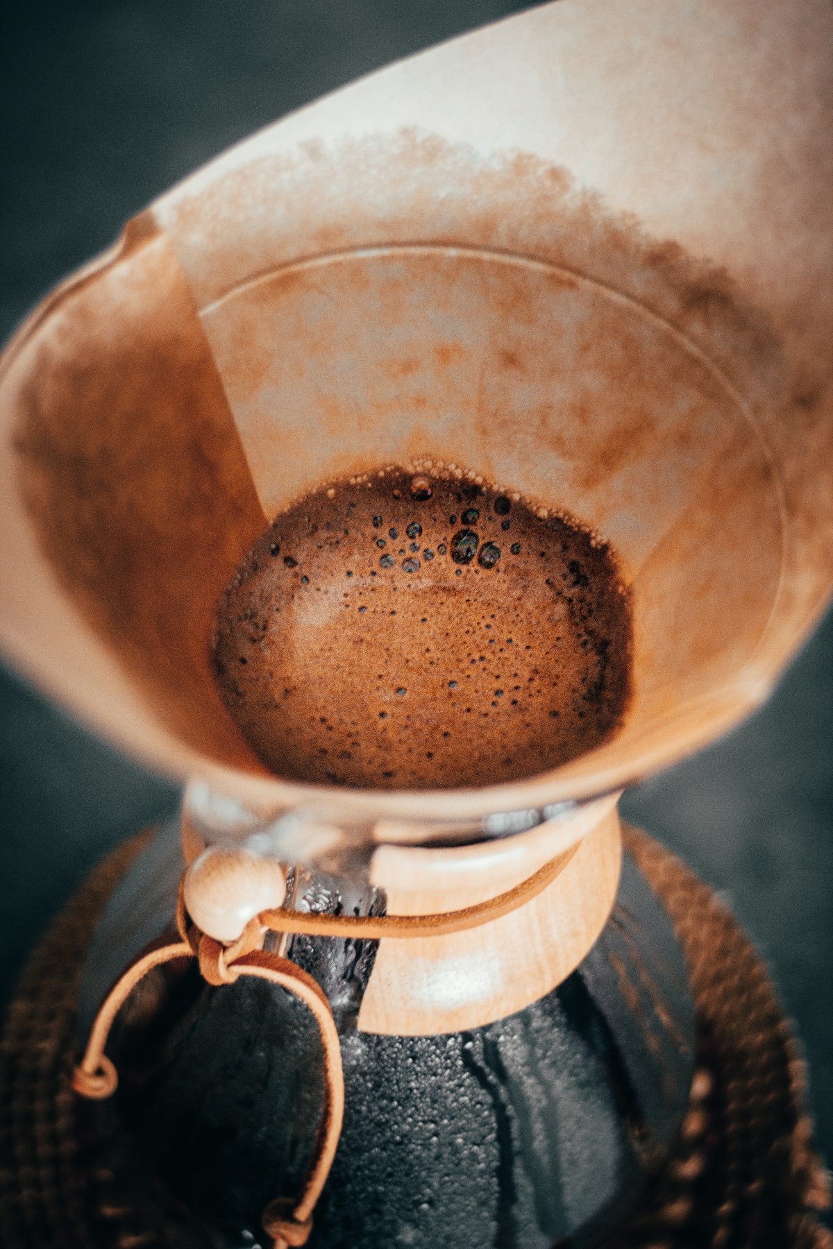 Coffee grounds blooming in a Chemex paper filter