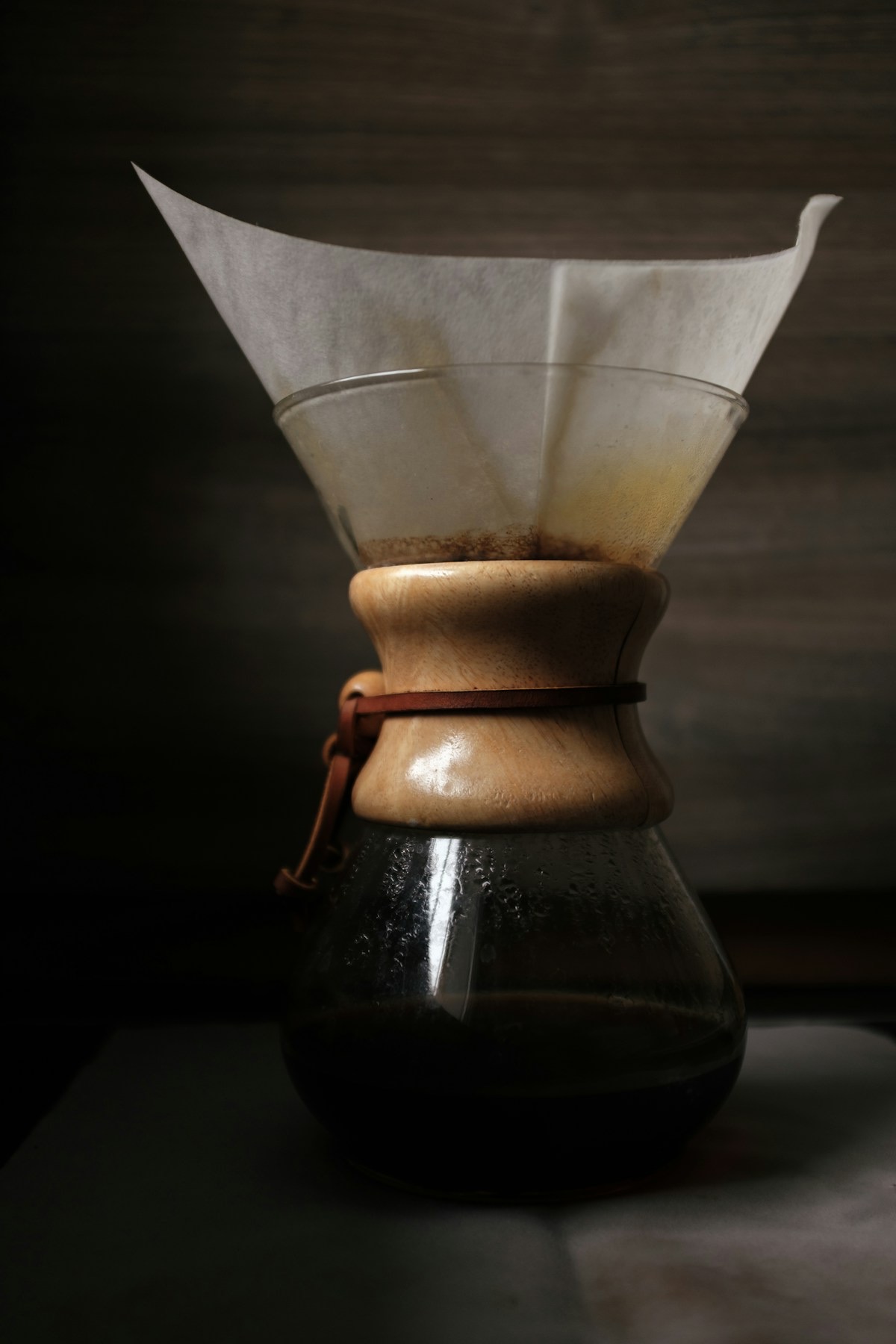 Thick Chemex bonded paper filter folded in a Chemex with coffee grounds