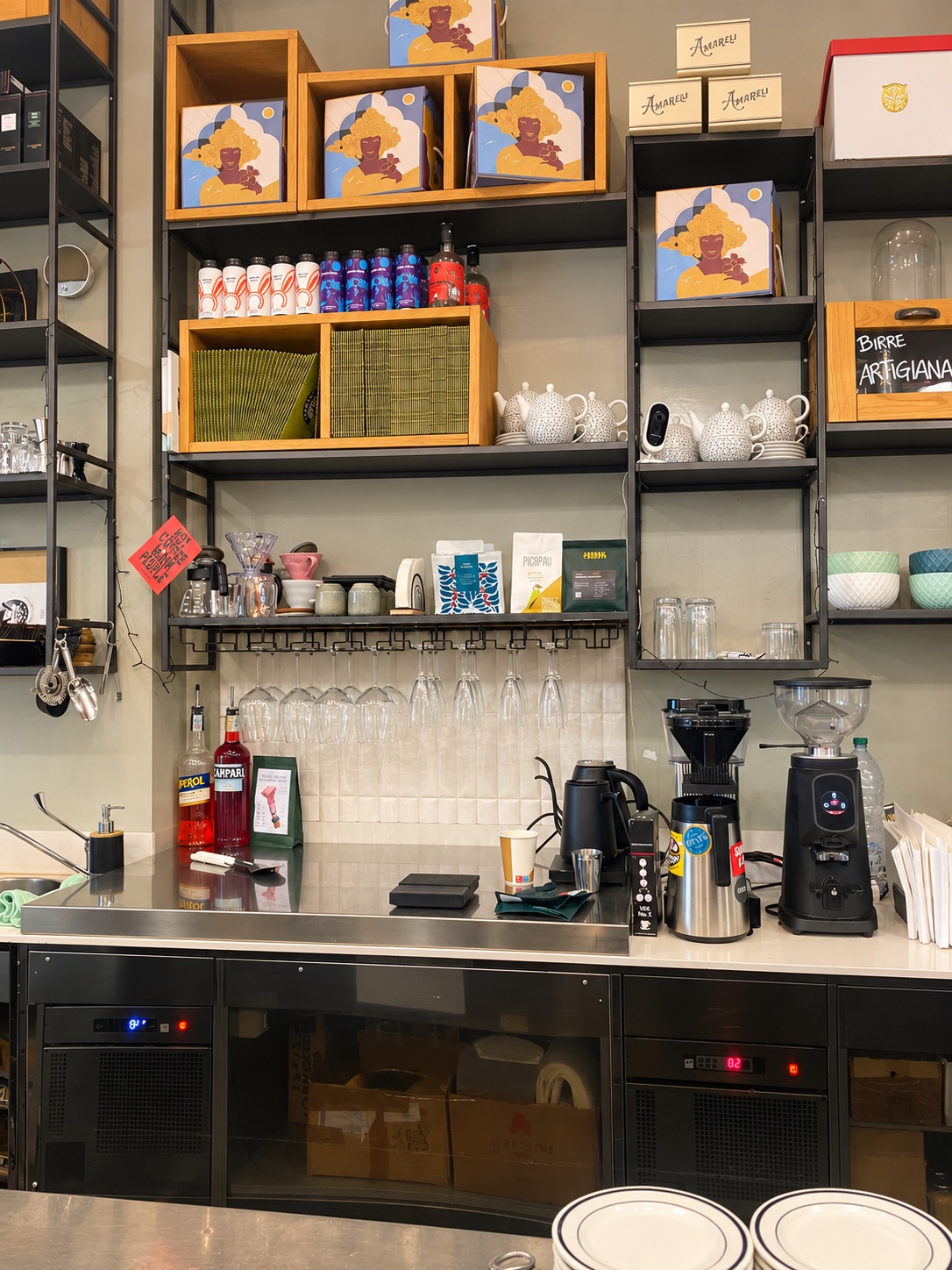 Nero Vaniglia's brew bar with a Moccamaster, a grinder, a gooseneck kettle and V60 drippers on the shelf