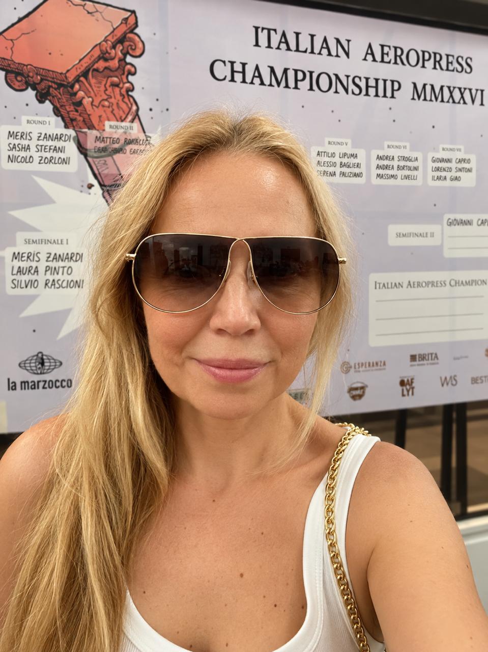 Sasha Pavlovich at the Italian AeroPress Championship 2026 in Rome, in front of the competition bracket